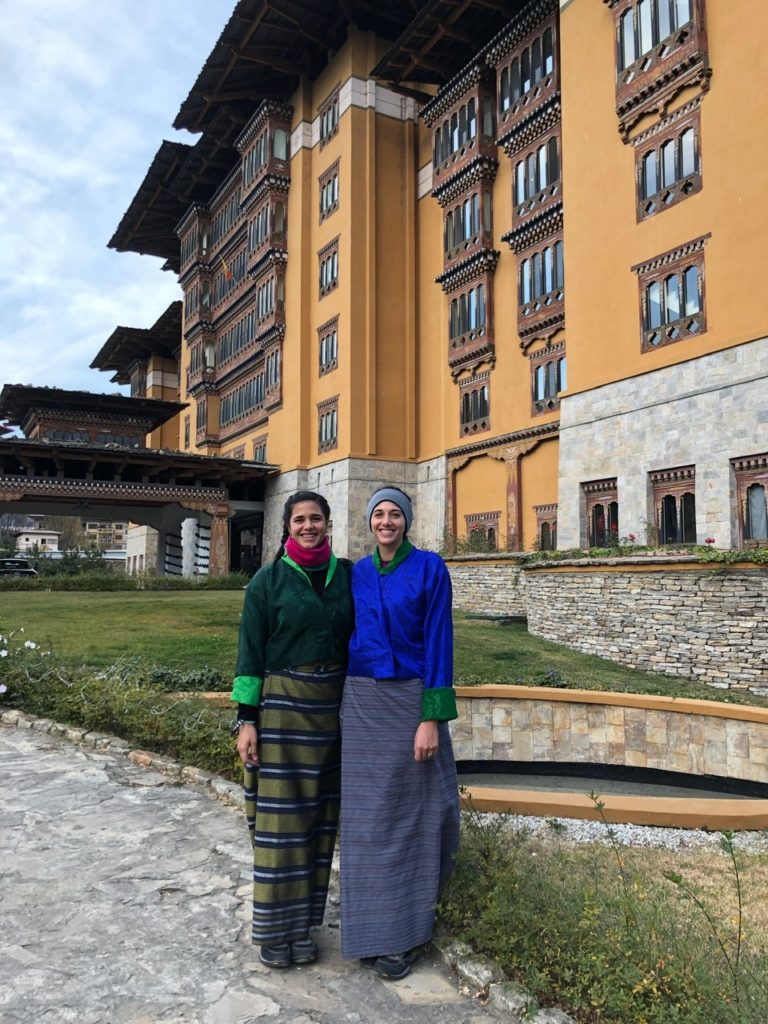 Me and my sister wearing tradition Bhutanese clothing in front of our hotel 