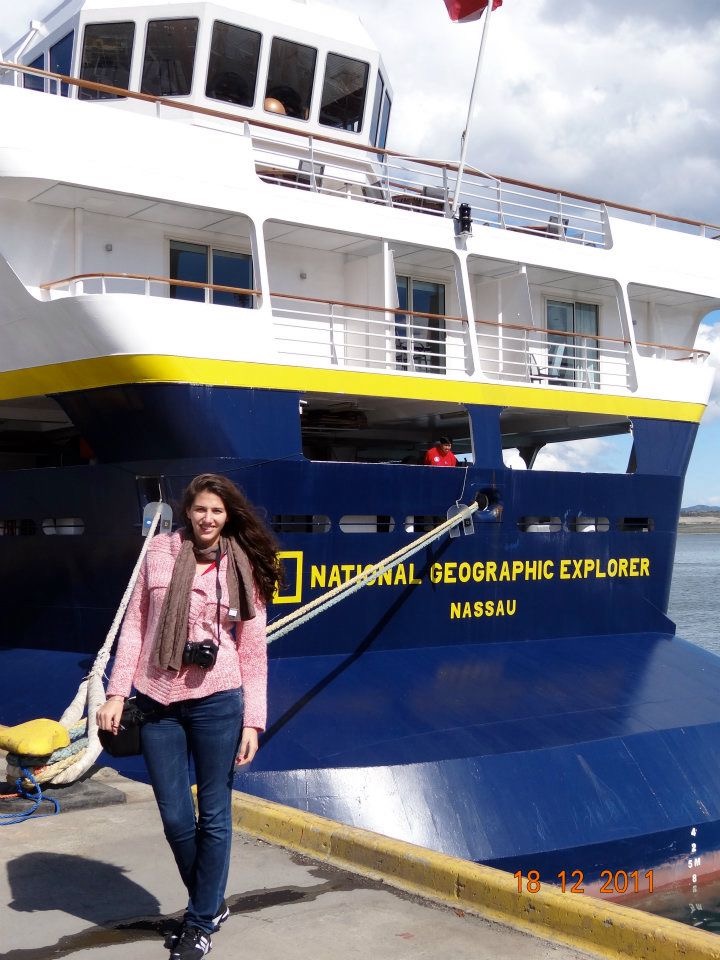 Woman standing in front of the National Geographic Explorer “Nassau” which was the boat for Antarctica journey 