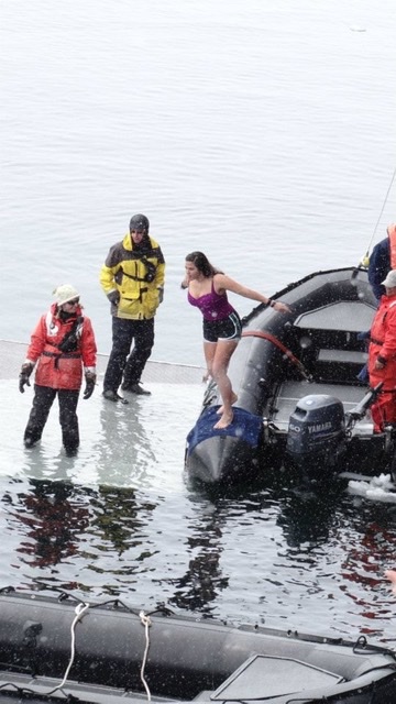 Woman doing the polar Plunge in Antarctica 