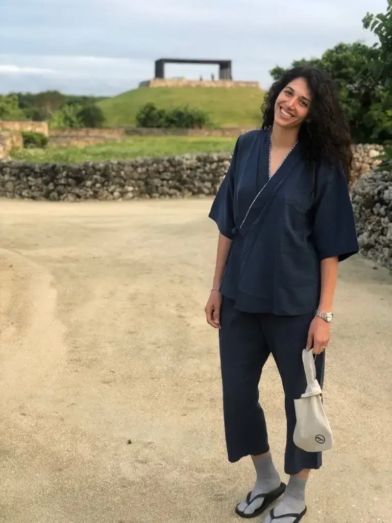 Woman wearing navy blue Japanese clothes in a hotel in Taketomi, Japan