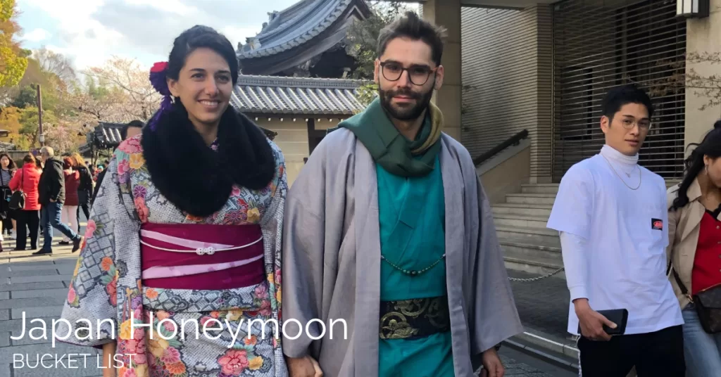 Man and woman dressed in typical japanese clothes in walking in old town Kyoto