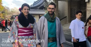 Man and woman dressed in typical japanese clothes in walking in old town Kyoto