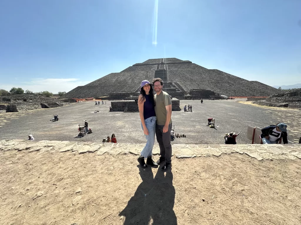 My husband and I visiting Teotihuacan in front of the pyramid of the sun