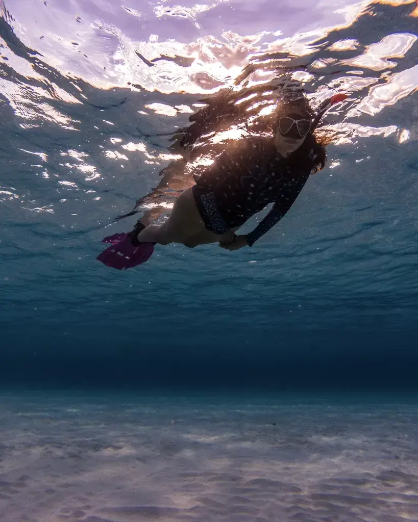 Woman snorkeling in one of the best beaches in Cozumel 