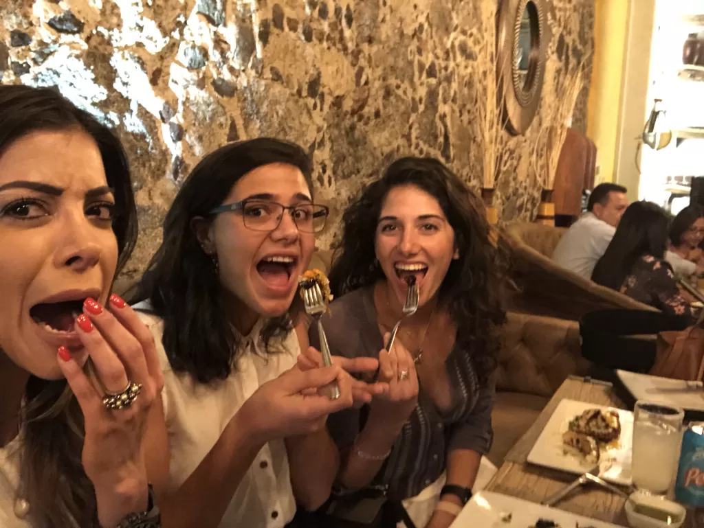 My sister and I eating chapulines in downtown Mexico City
