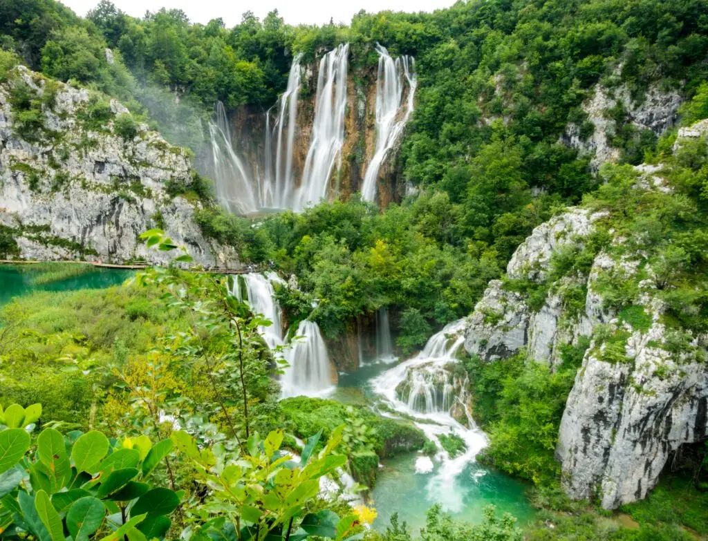 Waterfalls in Plitvice lakes national park gushing into the turquoise lakes 