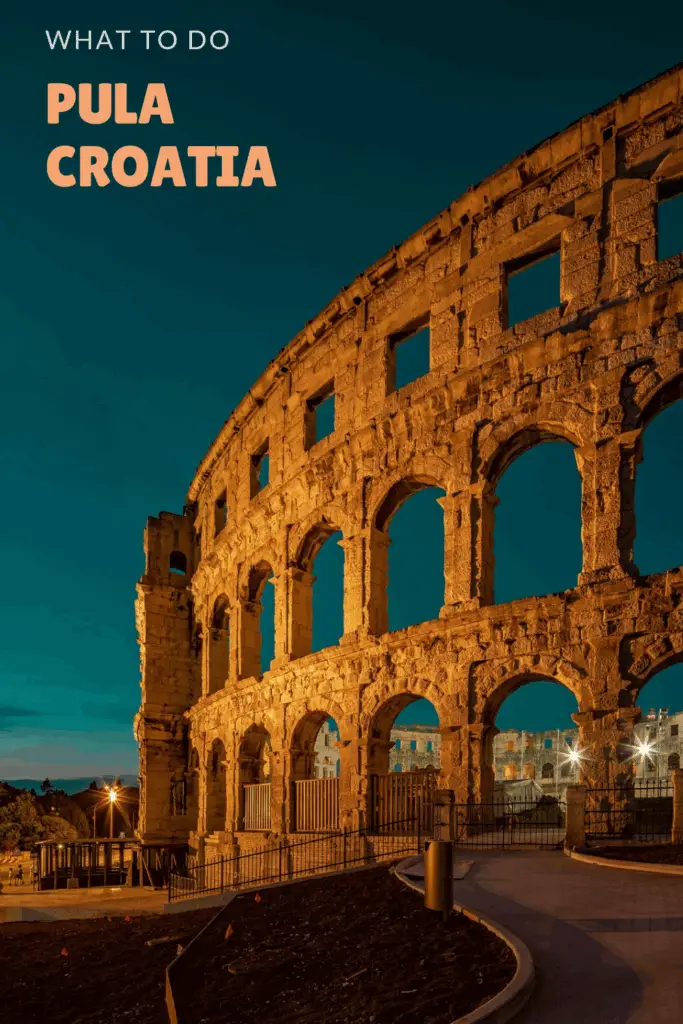 Image of Pula Arena in sunset lighting with the text on the left hand corner that reads Croatia with dogs: Pula Croatia