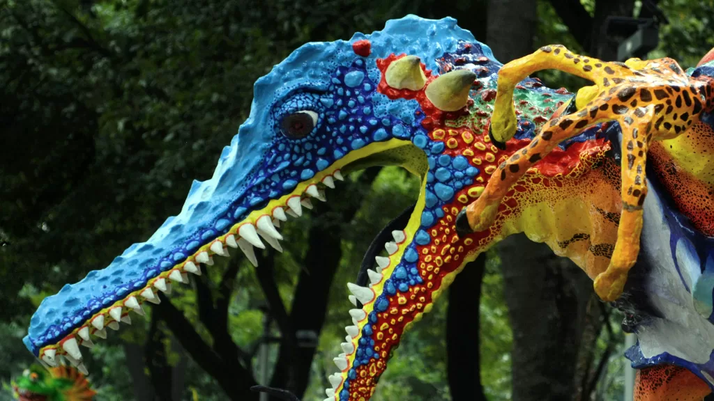 Monumental alebrije which is a fantastical creature in paiper mache painted with multiple colors 