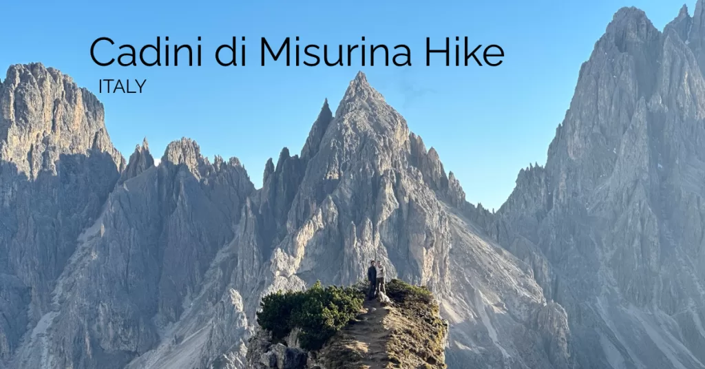 Featured image of the cadini peaks in the backgound with the cadini di misurina viewpoint in the Dolomites with the text cadini di misurina hike, Italy