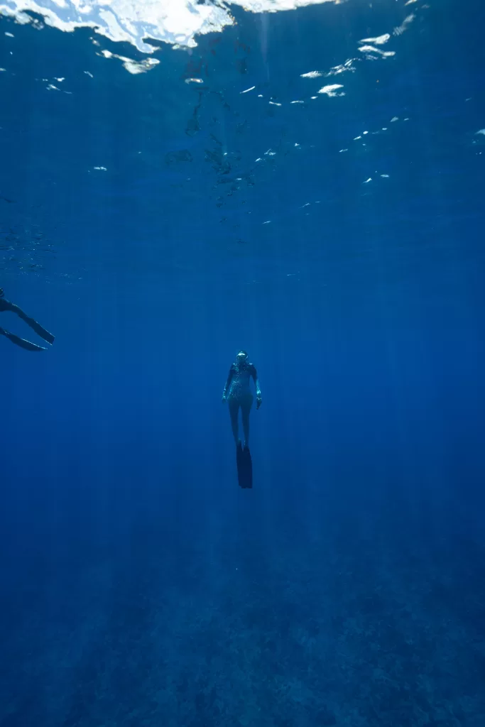 Me swimming in Moorea, photo of woman coming up from freediving