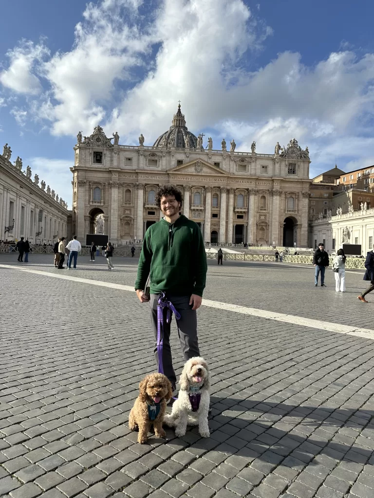 My husband and two dogs in st peter’s square in vatican city 