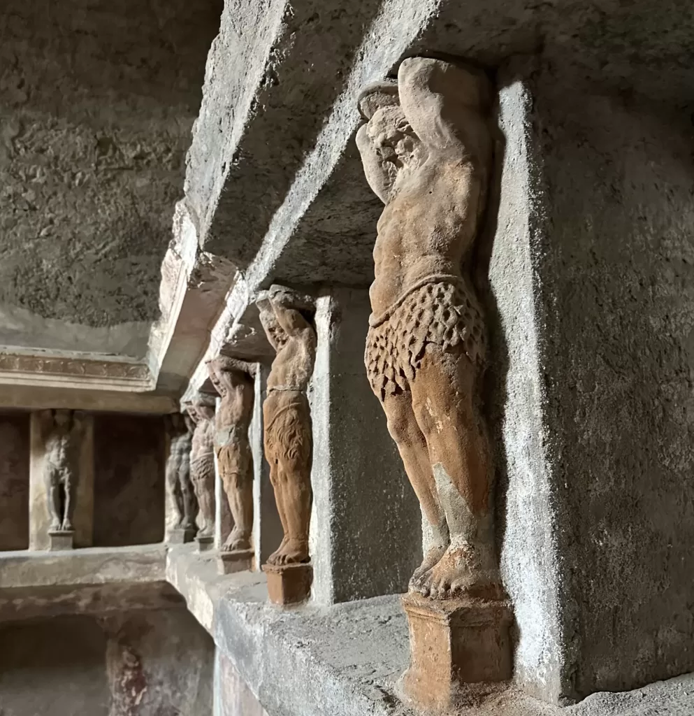 Statues adorning the baths in Pompeii
