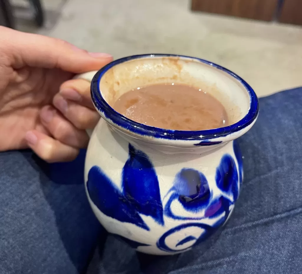 Typical mexican pottery cup with champurrado, a typical mexico christmas drink