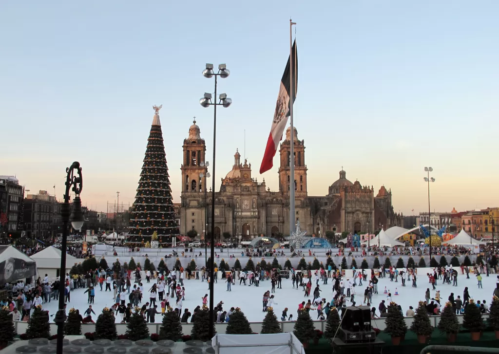Zocalo of mexico city decorated for christmas with an ice rink and huge christmas tree